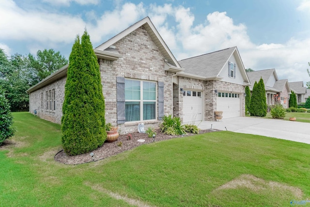 view of front of property featuring a front yard and a garage