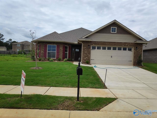 view of front of property with a garage and a front yard