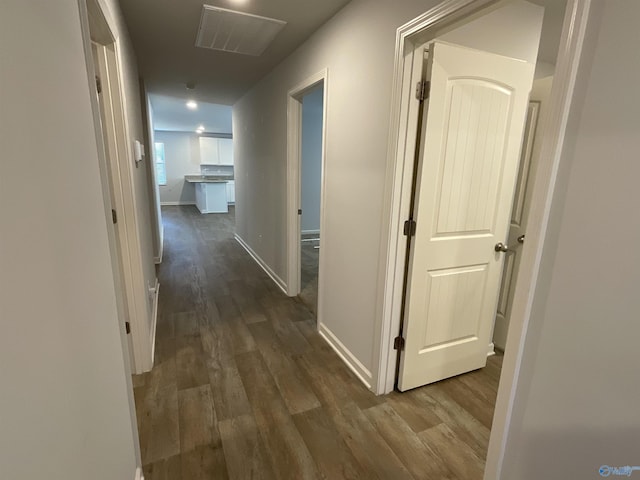 corridor featuring dark hardwood / wood-style flooring