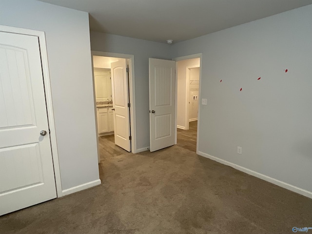 unfurnished bedroom with light colored carpet