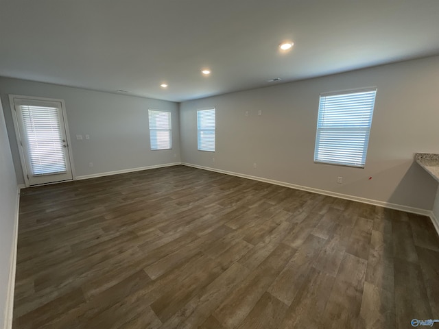 spare room featuring dark hardwood / wood-style floors