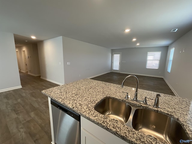 kitchen featuring stainless steel dishwasher, sink, light stone countertops, white cabinets, and dark hardwood / wood-style flooring