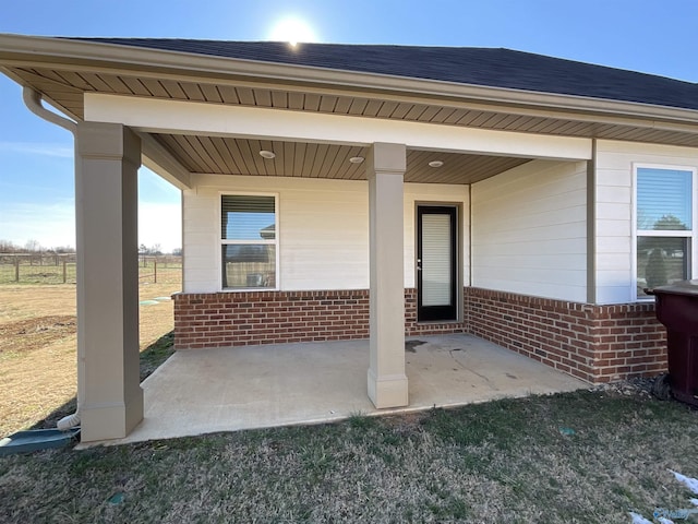 doorway to property with a patio