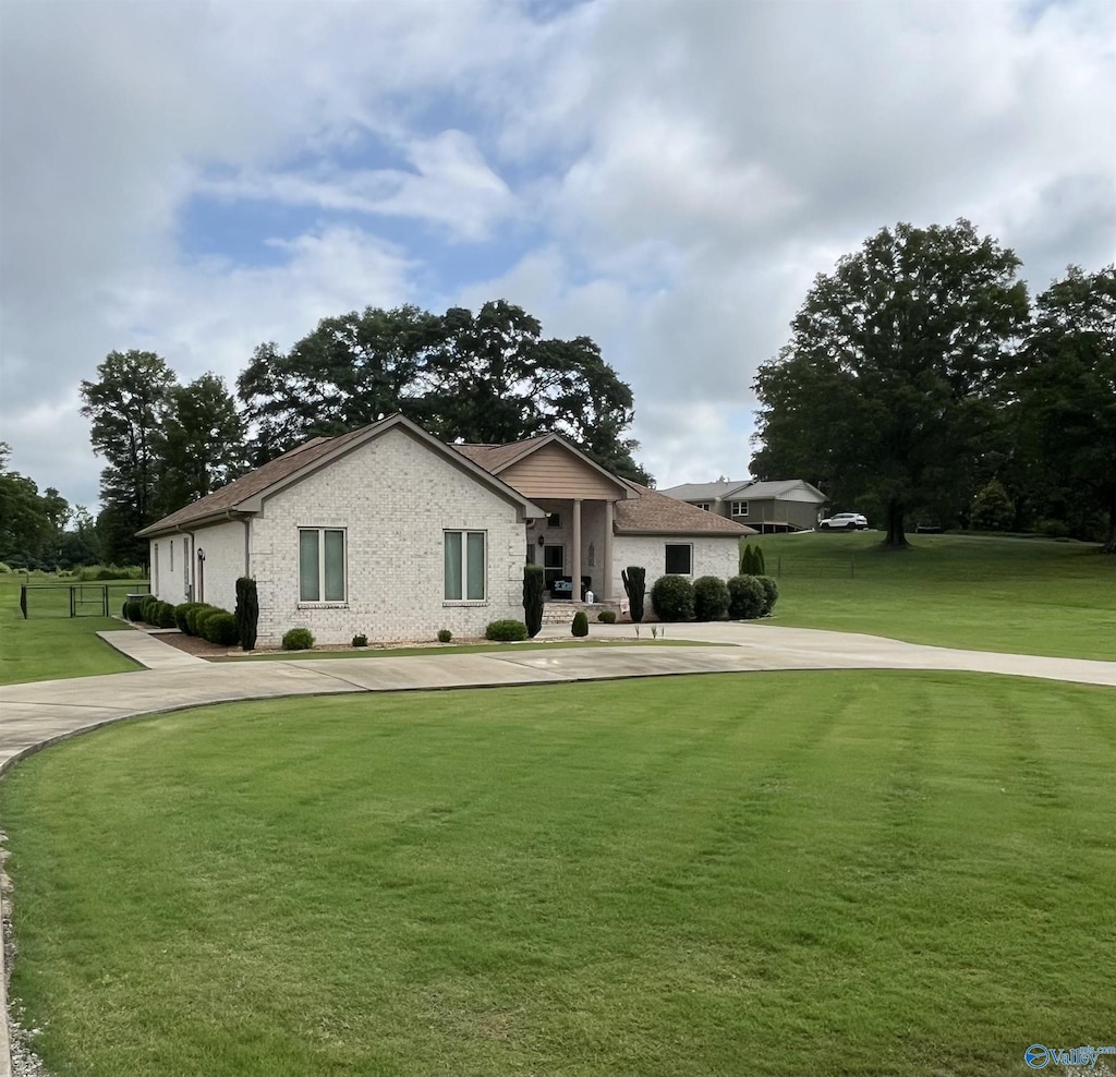 407 Barbee Ln, Scottsboro, AL 35769 - view of front of house featuring a front lawn and brick siding