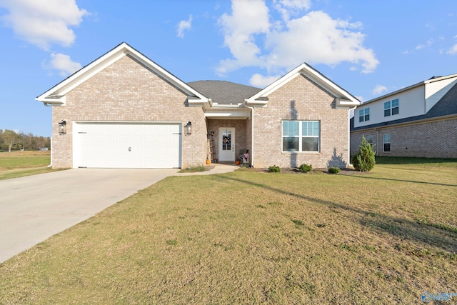 view of front of property featuring a garage and a front lawn