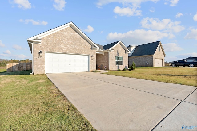 view of front of home with a front yard and a garage