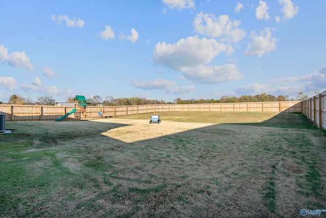 view of yard with a playground and central air condition unit