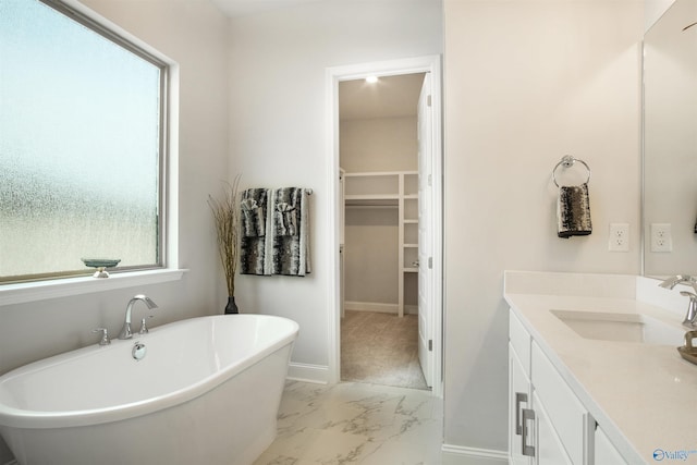 106 Kite Cir, Madison, AL 35756 - full bathroom featuring marble finish flooring, vanity, a spacious closet, and a freestanding tub