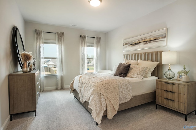 106 Kite Cir, Madison, AL 35756 - bedroom featuring light carpet and baseboards
