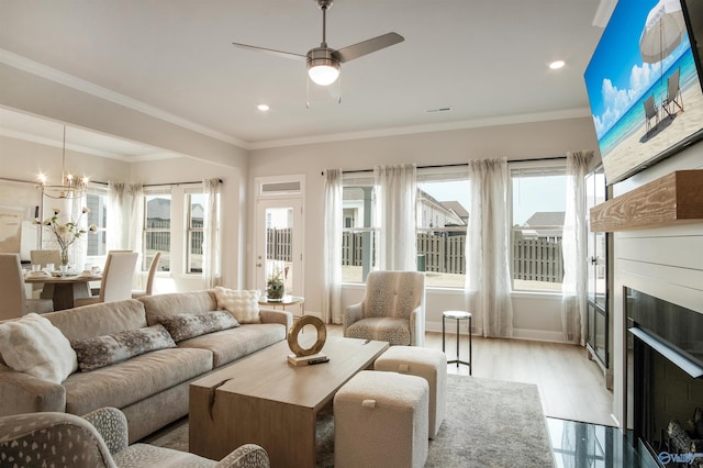 106 Kite Cir, Madison, AL 35756 - living room with healthy amount of natural light, a fireplace, ceiling fan, crown molding, and recessed lighting