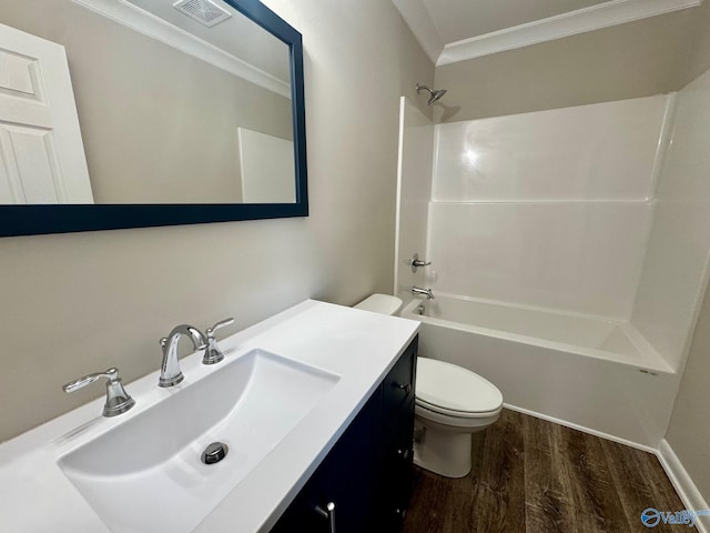 bathroom with shower / tub combination, toilet, wood finished floors, visible vents, and ornamental molding