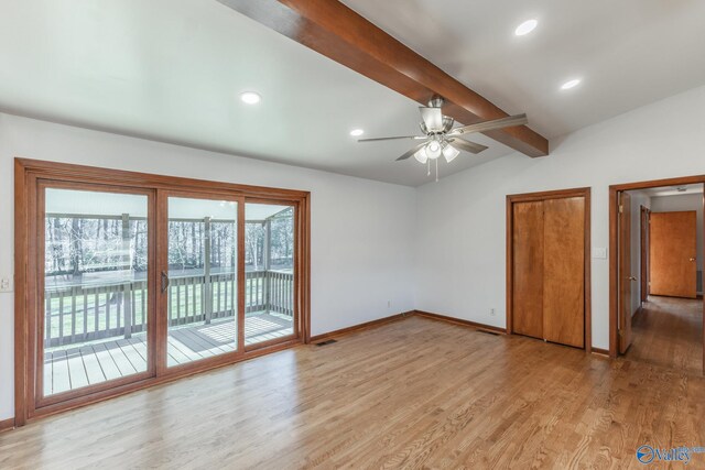 unfurnished bedroom featuring visible vents, baseboards, lofted ceiling with beams, light wood-style floors, and access to outside