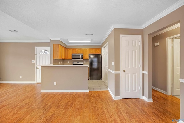 kitchen featuring light hardwood / wood-style flooring, ornamental molding, a textured ceiling, and black fridge