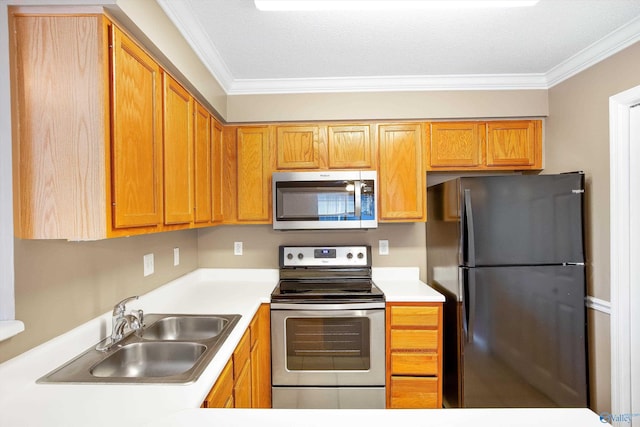 kitchen featuring crown molding, appliances with stainless steel finishes, and sink