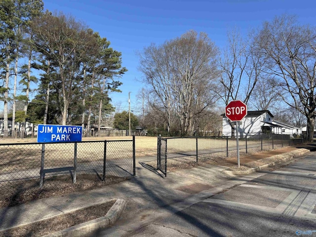 view of street featuring traffic signs and sidewalks