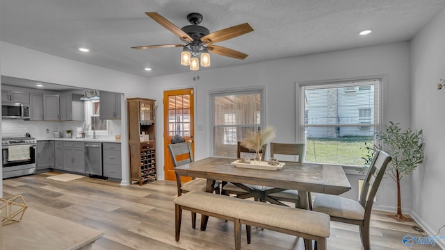 111 Althea St, Gadsden, AL 35904 - dining space with healthy amount of natural light, light wood-style floors, ceiling fan, and recessed lighting