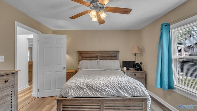 111 Althea St, Gadsden, AL 35904 - bedroom with light wood-type flooring, a ceiling fan, and baseboards