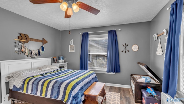 111 Althea St, Gadsden, AL 35904 - bedroom featuring a textured ceiling, wood finished floors, ceiling fan, and baseboards