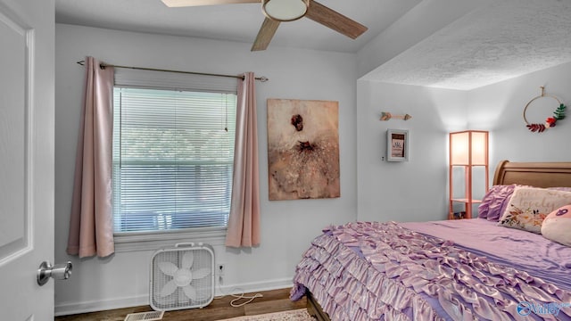 111 Althea St, Gadsden, AL 35904 - bedroom with multiple windows, wood finished floors, ceiling fan, and baseboards