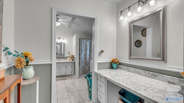 111 Althea St, Gadsden, AL 35904 - bathroom featuring marble look tiles, vanity, ceiling fan, and lofted ceiling