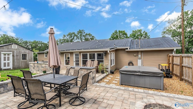 111 Althea St, Gadsden, AL 35904 - view of patio / terrace with a hot tub and outdoor dining area