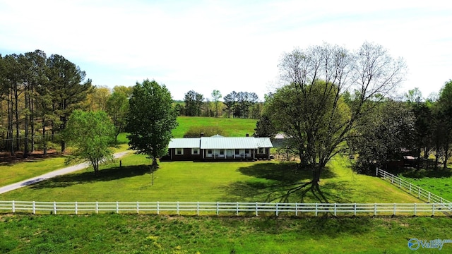 view of home's community with a yard and a rural view