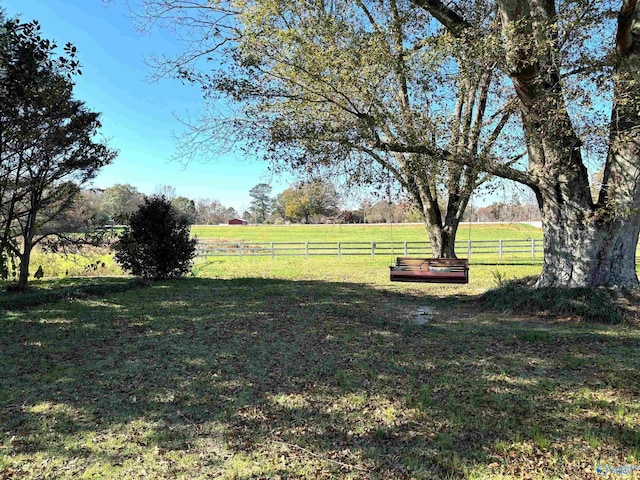 view of yard with a rural view