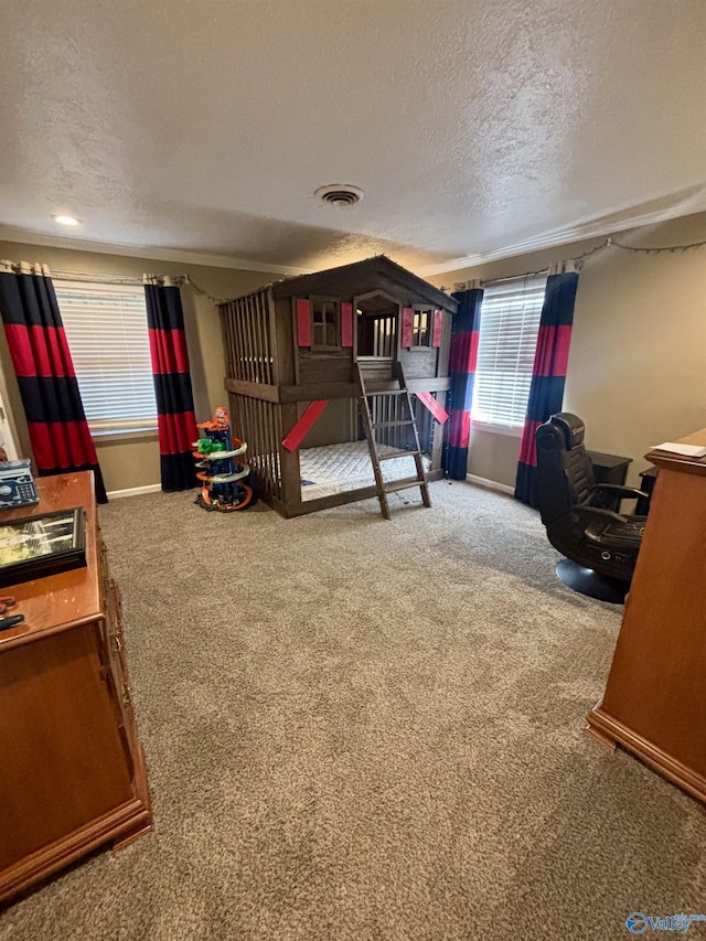 carpeted bedroom featuring a textured ceiling