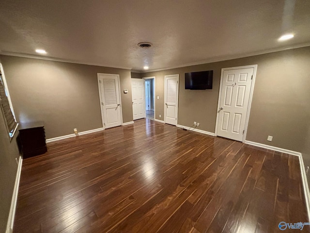 unfurnished bedroom with dark hardwood / wood-style flooring