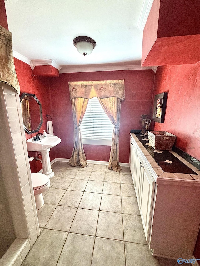 bathroom with tile patterned floors, toilet, and ornamental molding