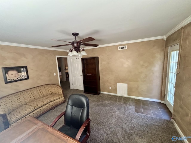 unfurnished office with dark carpet, ceiling fan, and crown molding