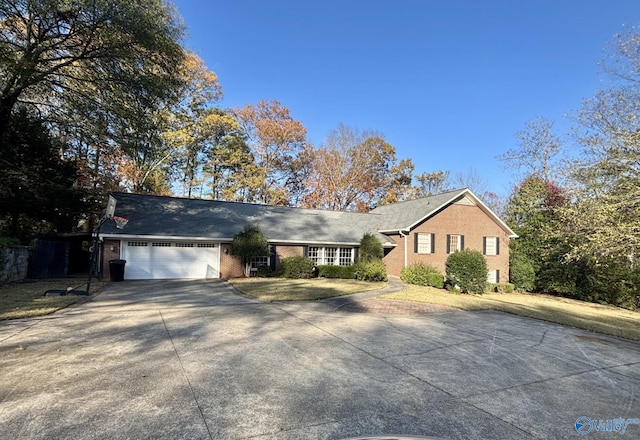 ranch-style home featuring a garage