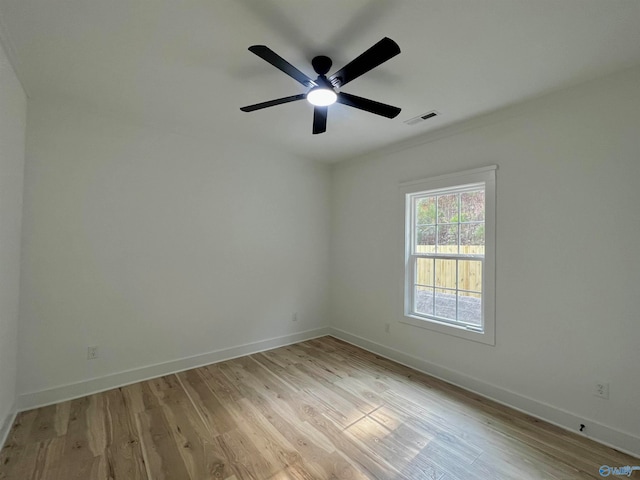 empty room featuring light hardwood / wood-style flooring and ceiling fan