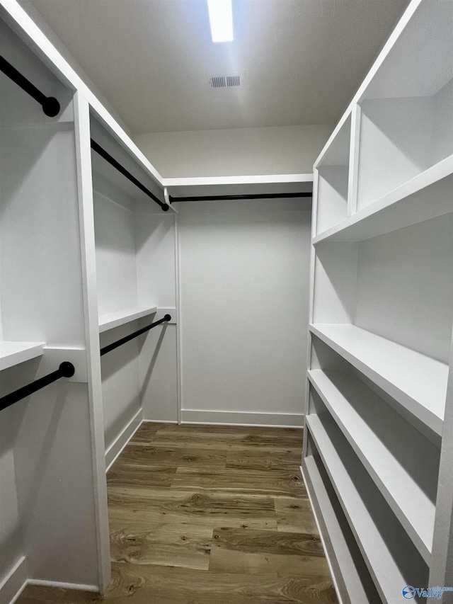 1921 Patterson St, Guntersville, AL 35976 - spacious closet featuring dark wood-style flooring