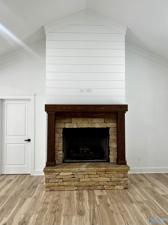 1921 Patterson St, Guntersville, AL 35976 - detailed view of wood finished floors, a fireplace with raised hearth, baseboards, and crown molding