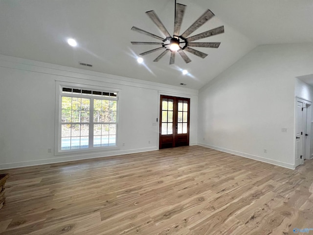 unfurnished living room featuring french doors, vaulted ceiling, light hardwood / wood-style flooring, and ceiling fan