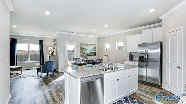 kitchen with sink, white cabinetry, a kitchen island with sink, stainless steel appliances, and dark hardwood / wood-style floors