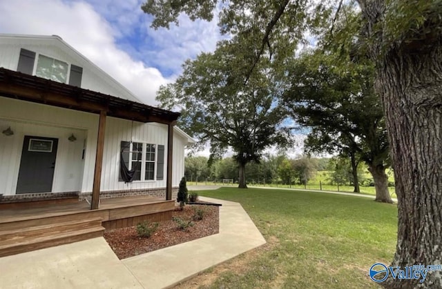 view of yard featuring covered porch