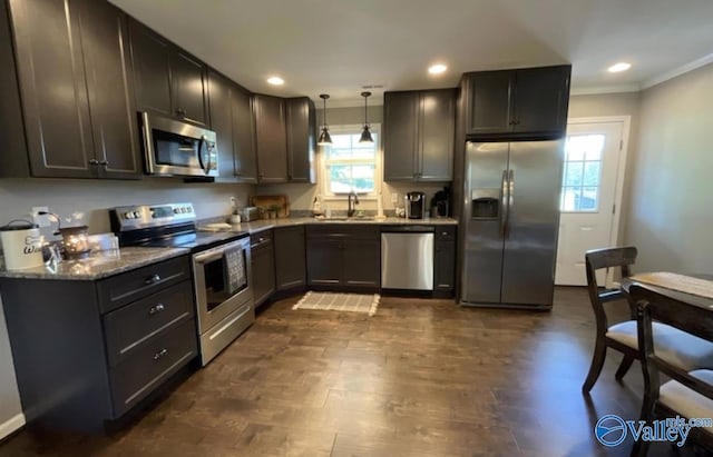 kitchen with a healthy amount of sunlight, appliances with stainless steel finishes, a sink, and recessed lighting