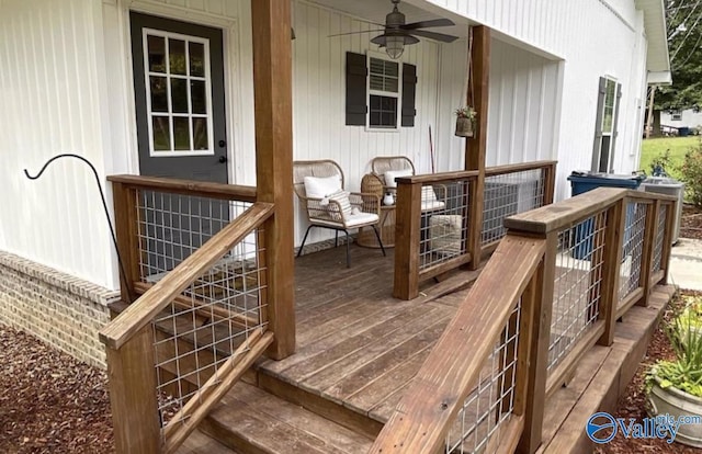 wooden deck featuring ceiling fan