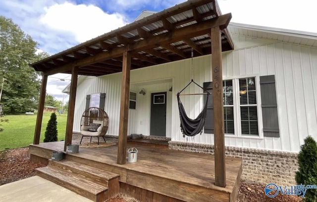 wooden terrace with a lawn