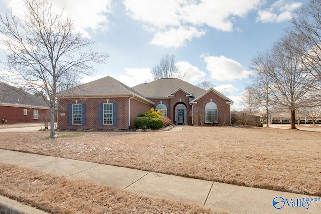 view of front of home featuring brick siding