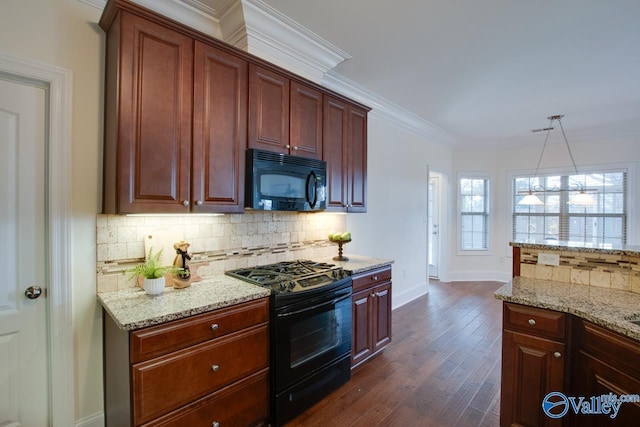 kitchen with light stone countertops, black appliances, tasteful backsplash, and crown molding