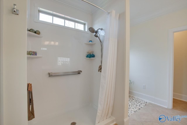 bathroom with a shower with curtain, baseboards, ornamental molding, and tile patterned floors