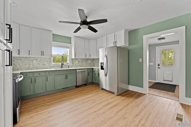 265 Dorning Rd, Harvest, AL 35749 - kitchen featuring appliances with stainless steel finishes, green cabinetry, a sink, tasteful backsplash, and ceiling fan