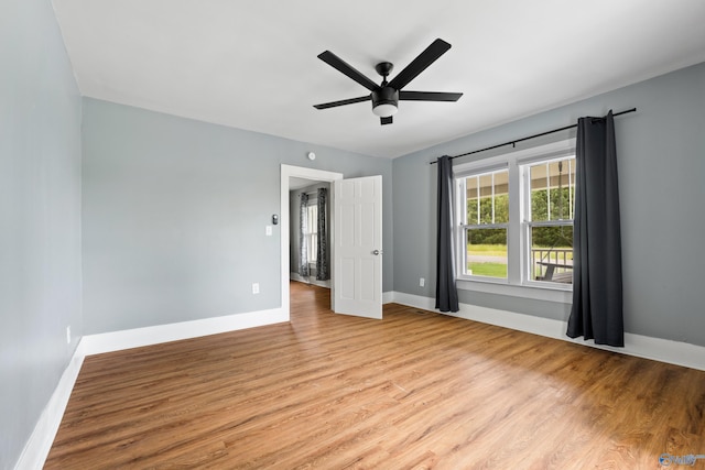 265 Dorning Rd, Harvest, AL 35749 - unfurnished bedroom with wood finished floors, baseboards, and a ceiling fan