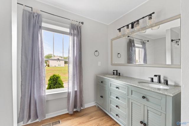 265 Dorning Rd, Harvest, AL 35749 - full bathroom with double vanity, wood finished floors, and baseboards