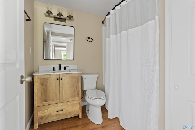 265 Dorning Rd, Harvest, AL 35749 - full bathroom with toilet, wood finished floors, vanity, and a shower with shower curtain