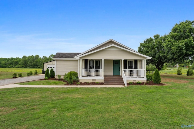 265 Dorning Rd, Harvest, AL 35749 - view of front of property with crawl space, driveway, covered porch, a front lawn, and an attached garage