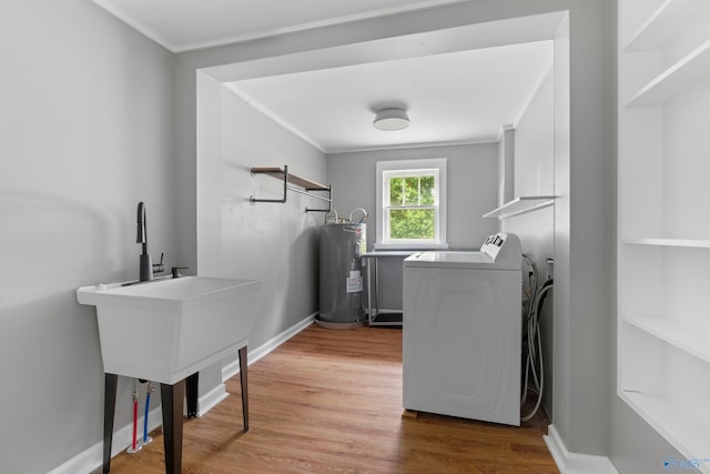 265 Dorning Rd, Harvest, AL 35749 - washroom featuring washer and dryer, electric water heater, crown molding, and wood finished floors